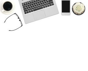 Office desk table with computer, supplies, coffee cup and flower. Isolated on white background. Top view with copy space