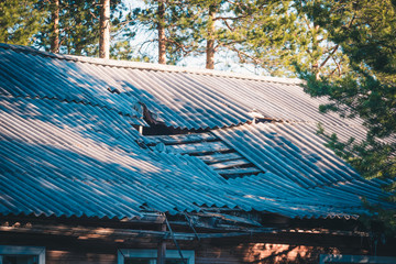 Failed slate roof in an old collapsed house.