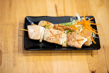 Grilled Salmon belly on Wooden table background, Japanese food