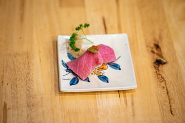 Chutoro, Otoro, Salmon, Sea bass sushi on Wooden table background