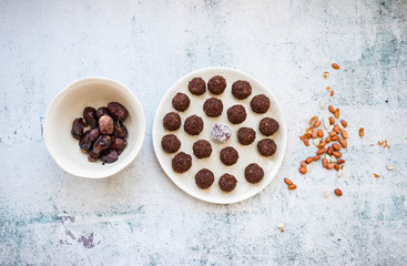 Protein energy balls with cocoa, carob, chocolate, coconut, dates, oatmeal. Dark vegan truffles sweets. Healthy dessert