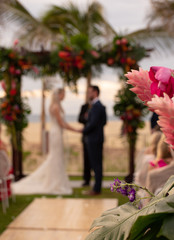 Destination wedding is one in which a wedding is hosted, often in a vacation-like setting, location to which most of the invited guests must travel and often stay for several days.