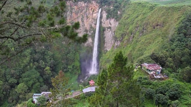 Underground river is cut off by the Sisso Pisso waterfall on the island of Sumatra, Indonesia. Camera movement