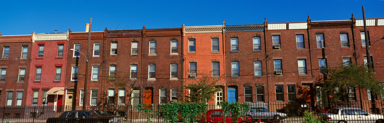 Fototapeta na wymiar Panoramic morning view of red brick row houses of Philadelphia, PA