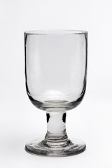 A 19th Century collectable antique clear, heavy glass on a plain white background.
