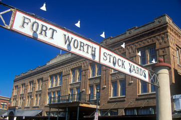 Banner at the Fort Worth Stock Yards with historic hotel, Ft. Worth, TX
