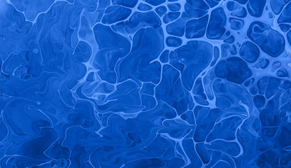 Acrylic Fluid Art. Blue colors waves and spot drops. Abstract aqua background or texture