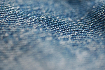 Jeans denim texture close up , focus only one point , soft blured background wallpaper