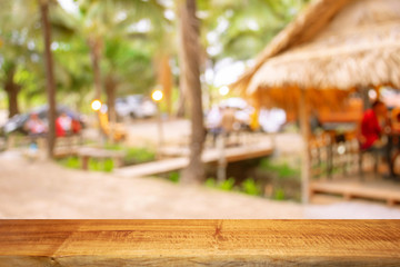Display products on a brown wooden table in a forest park.
