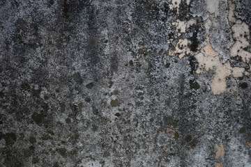 The background of the old concrete surface has discolored and worn out colors