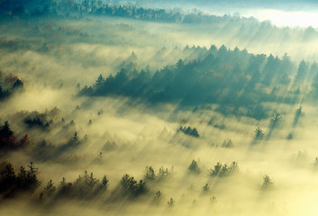 Obraz na płótnie Canvas Aerial view of Morning fog and sunrise in autumn near Stowe, VT on Scenic Route 100