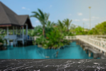 display products on the table, background, beside the pool and water pavilion
