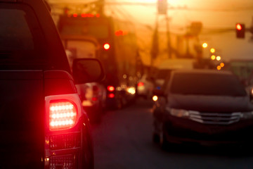 Blurred image of cars on the road with light break at in evening.