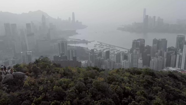 Hong Kong skyline reveal on foggy day 