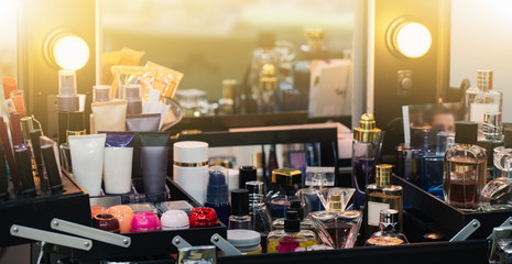 Mirror with round lamps. Cosmetics for makeup women. Dressing table with a mirror.	