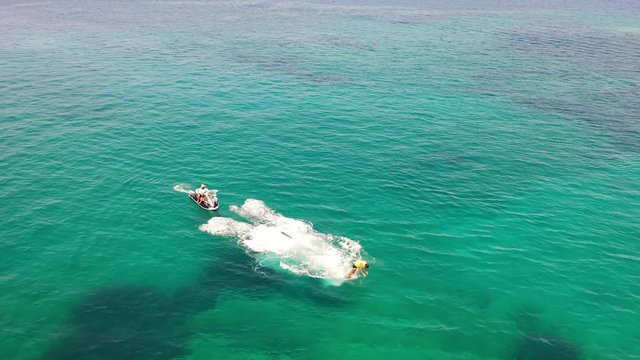 Aerial view of a person flyboarding in the sea. Elounda, Crete, Greece