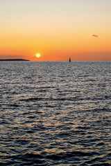 Sailing boats on a background of a beautiful sunset