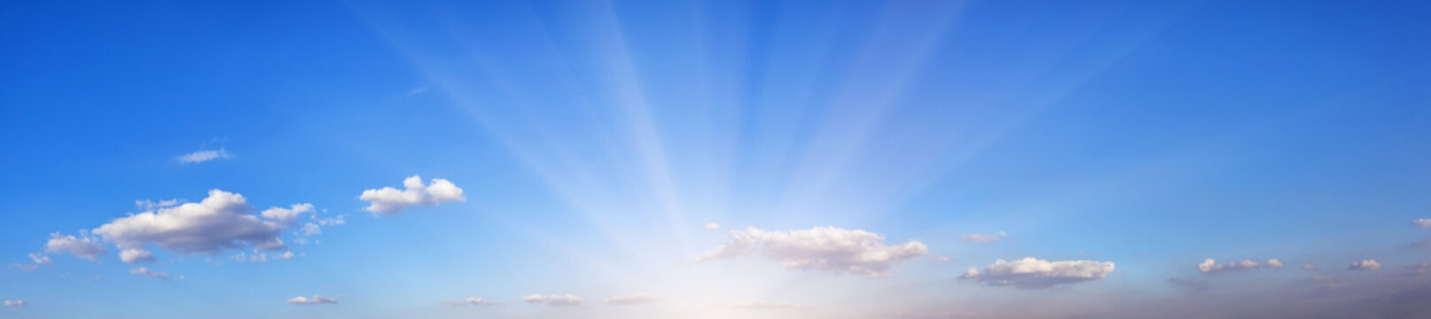 Panorama of blue sky with bright sun