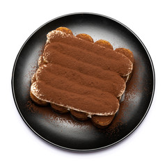 Classic tiramisu dessert on ceramic plate isolated on white background with clipping path