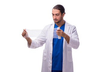 Young male doctor isolated on white