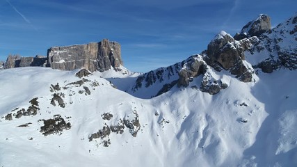 Aerial of winter landscape, winter sports like ski touring in the mountains, 4K.