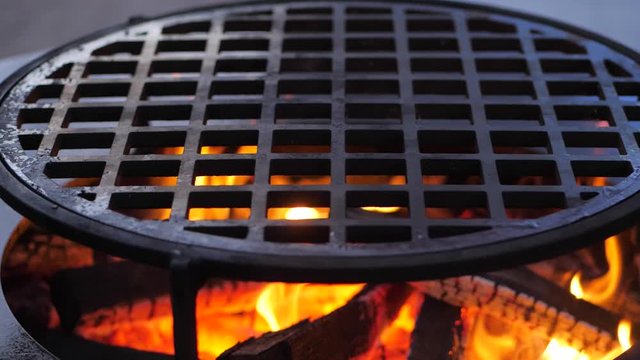 slow motion. fire is burning on the charcoal grill.Ofyr charcoal grill. close-up