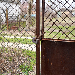 on an iron gate the castle weighs on a chain