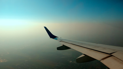 the wing of the aircraft is visible in the porthole