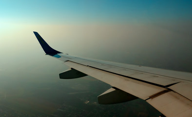 the wing of the aircraft is visible in the porthole