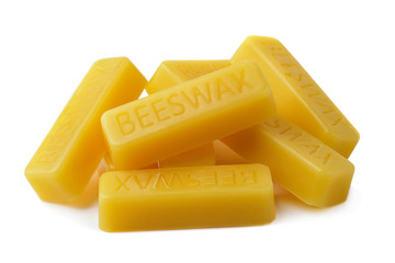 Beeswax on a white background.Beeswax blocks. Natural beeswax.