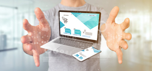 Businessman holding a Laptop and a smartphone - 3d rendering