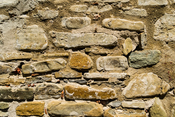 Textured wall, background. The background of a textured wall made by stone, pattern.