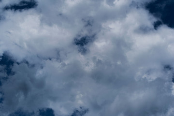 Fluffy white clouds on a beautiful blue sky.