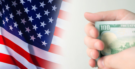 Receive money. Salary. Savings. Capital. Investments in the United States. Cash reserve funds. A man hides dollars against the background of the flag of the United States of America.