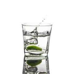 sliced kiwi fruit splashing falling in water glass isolated on white background