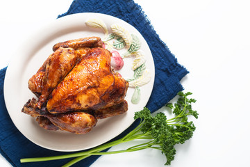 Food concept homemade Roasted, Grilled Whole organic chicken on white ceramic plate