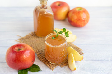 Freshly squeezed apple juice on a white background. Useful vitamin, antiviral drink.