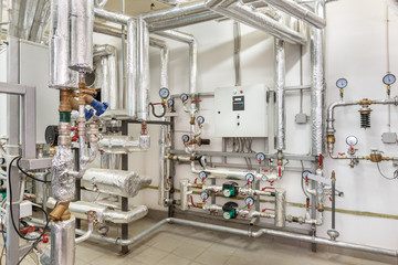 interior of an industrial boiler house, technological unit with many sensors, indicators and valves