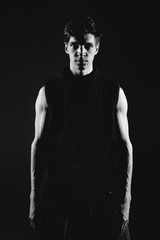 A dancer in red slacks and a t- shirt