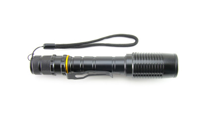 Slim, graceful flashlight in black on a white isolated background. Manual LED flashlight with a...