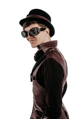 Steampunk actor in glasses and hat posing.
