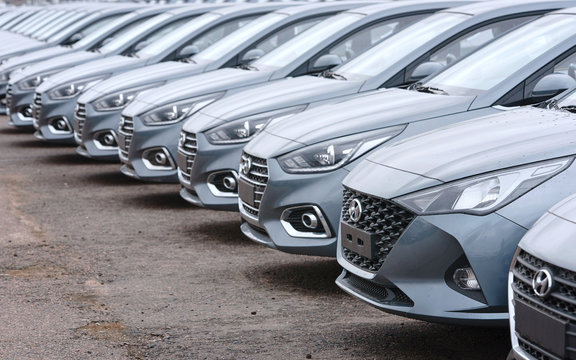 Minsk, Belarus. Mar 2020. Hyundai cars parked in row the parking lot of an authorized dealer. New cars on holding yard. Hyundai Accent vehicles on the parking in row. New cars for sale