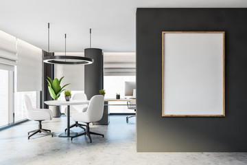 Gray CEO office with lounge area and poster