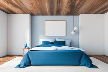 White and blue bedroom with horizontal poster