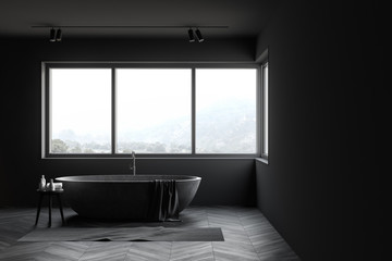 Gray bathroom interior with stone tub