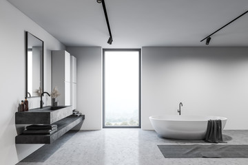 Loft white bathroom interior with tub and sink