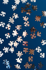 puzzle with a image of young male face, stress and mind problems flat lay on the table, solve the puzzle pieces