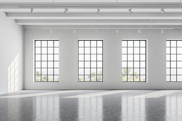 Empty white office room with windows