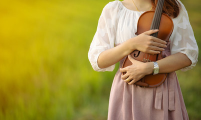 woman playing the violin at park © ittipol