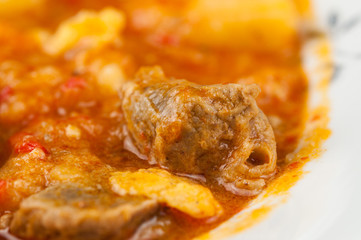 Cooked dish on a plate isolated on white background